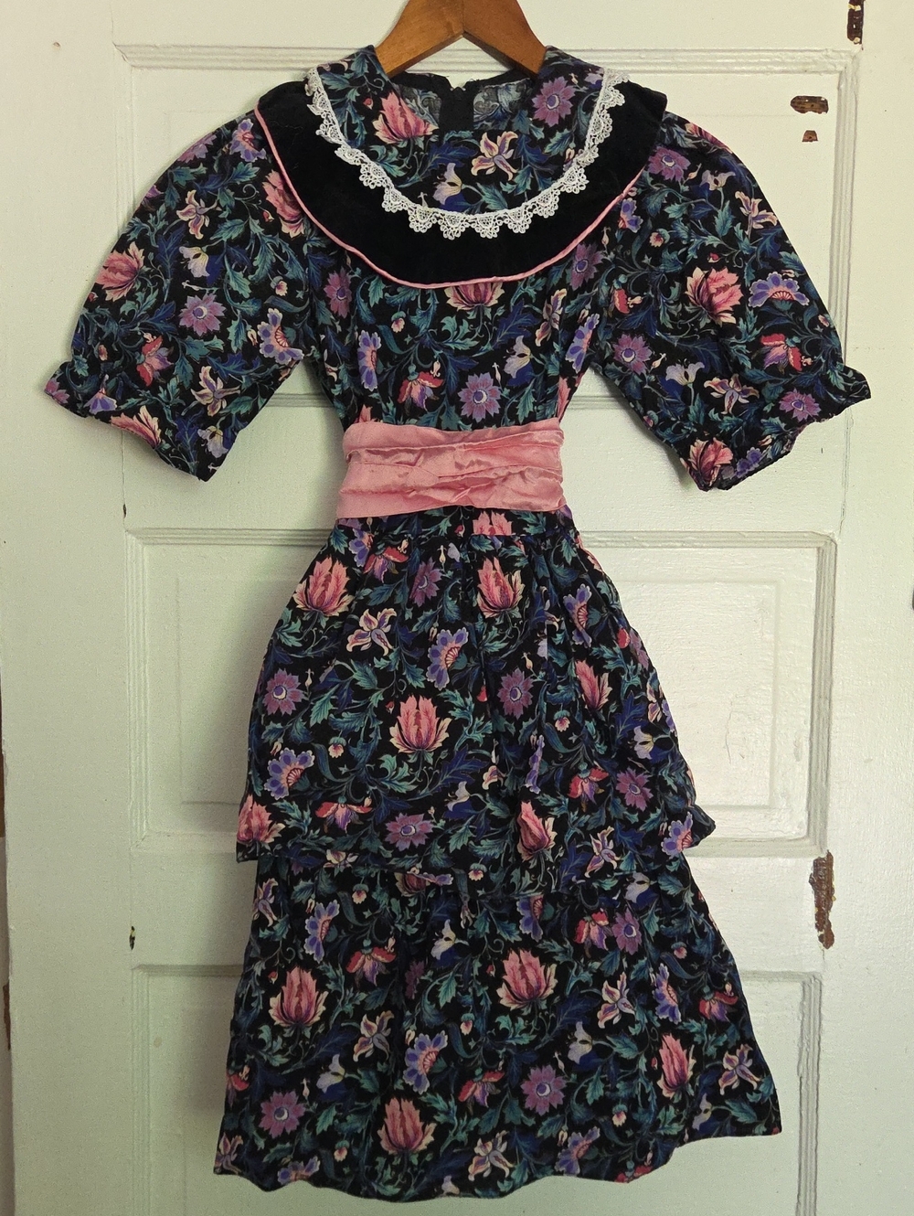 Black Floral Tiered Girls' Dress with Pink Sash and Lace Collar